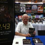 Hal Higdon displays his new book at HK's booth. 