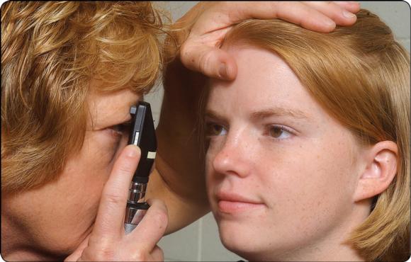 Figure 19.8 Eye examination using an ophthalmoscope.